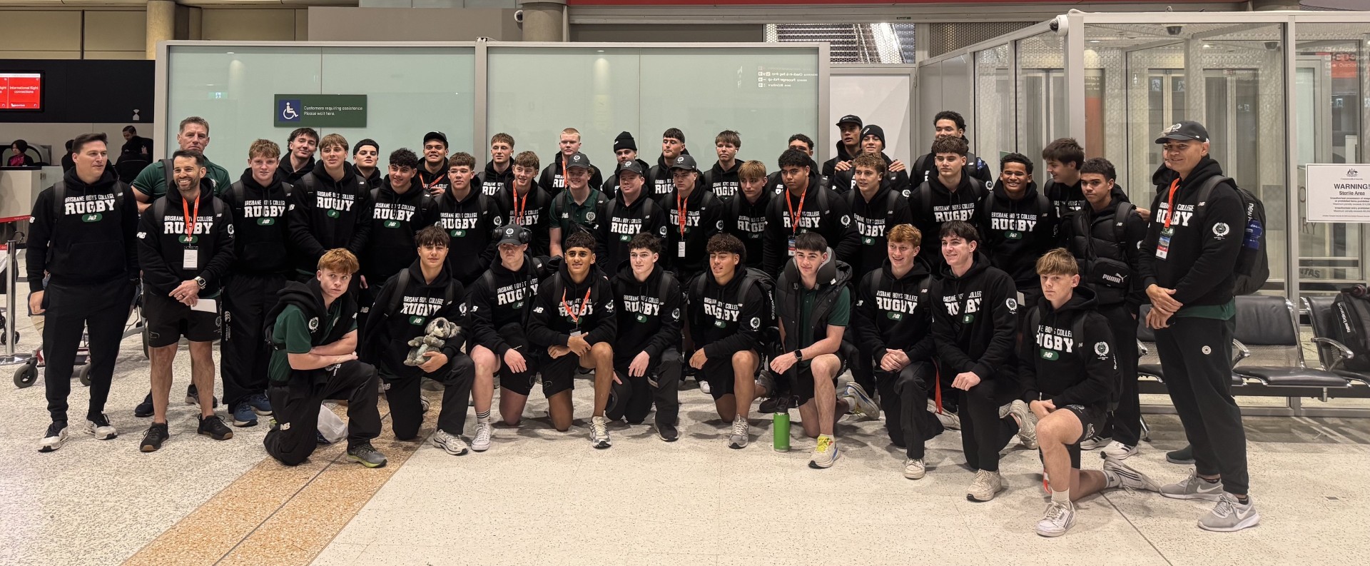 Brisbane Boys College departing for their flight at Brisbane airport.